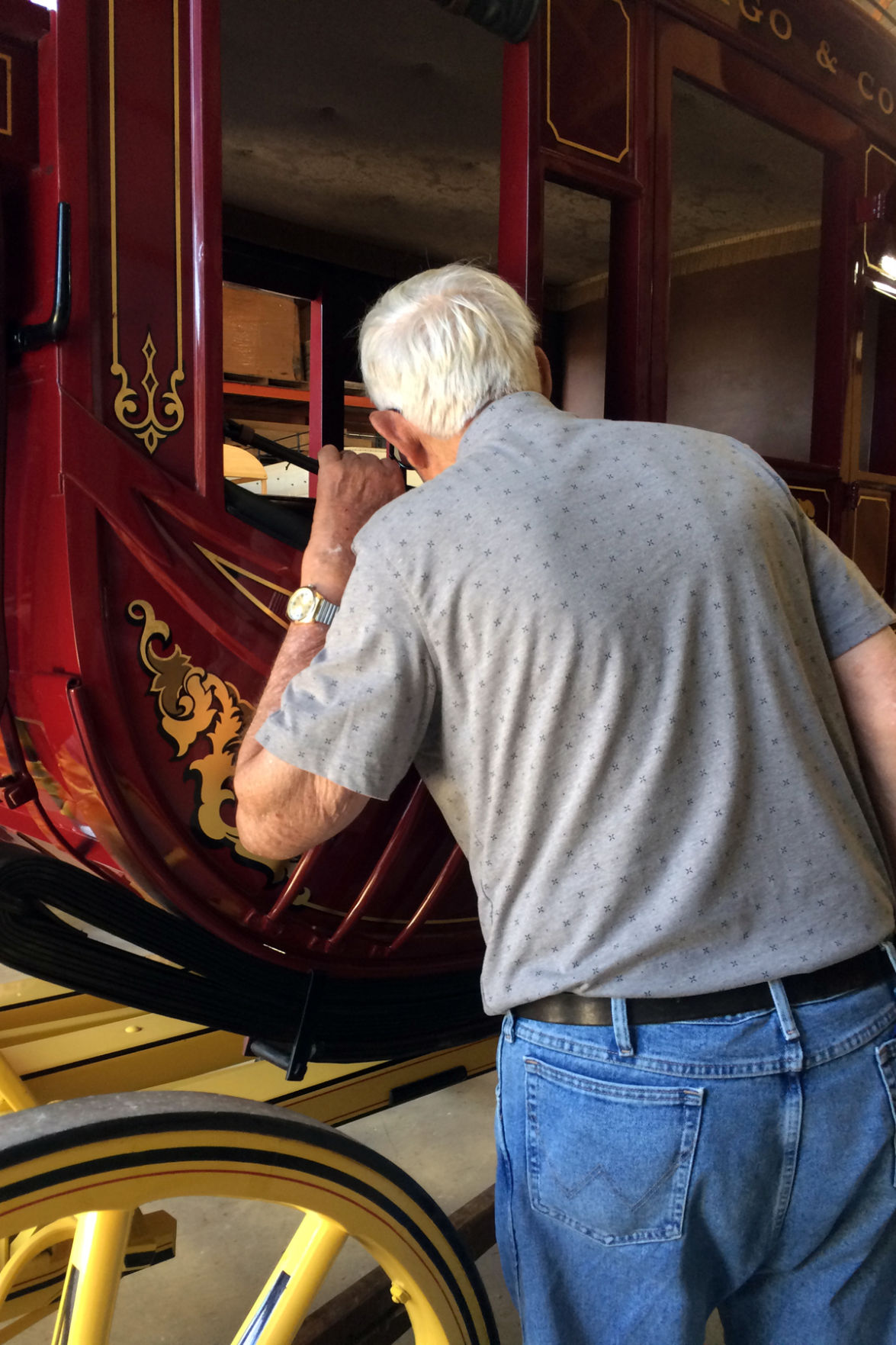 107 Darwin Petersen peeks into the Wells Fargo wagon.JPG